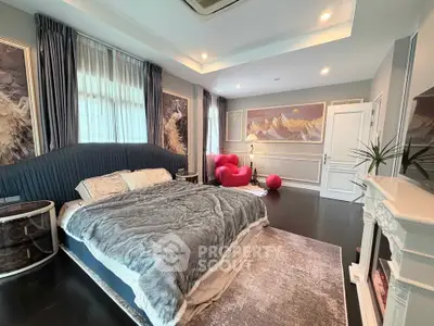 Luxurious bedroom with elegant decor and plush furnishings in a modern home.
