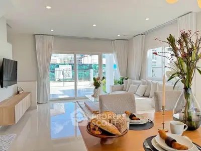 Spacious modern living room with elegant decor and natural light