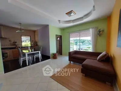 Spacious open-plan living room with dining area and garden view