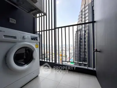Modern apartment balcony with washing machine and city view