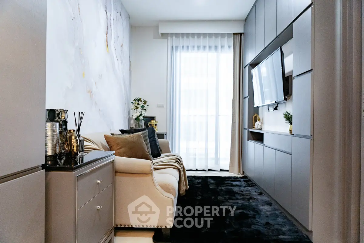 Luxurious modern living room with elegant decor and large TV