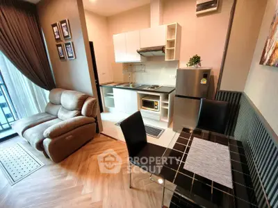 Modern apartment with cozy living area and compact kitchen