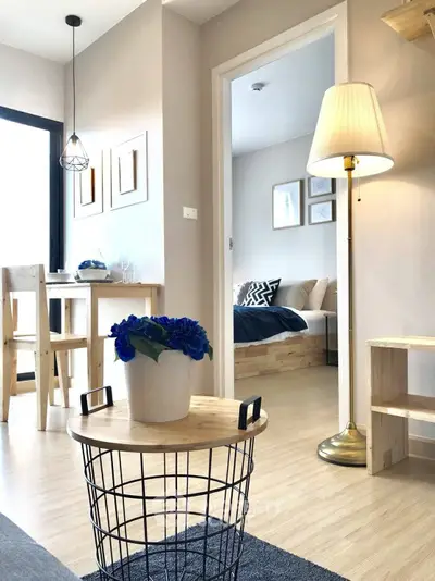 Modern living room with stylish decor and cozy bedroom view