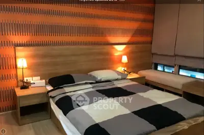 Cozy modern bedroom with stylish decor and ambient lighting
