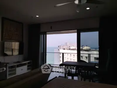 Stunning ocean view from modern living room with balcony access