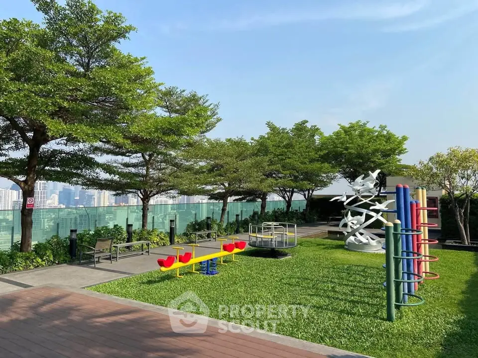 Stunning rooftop garden with playground and city skyline views, perfect for family relaxation and entertainment.