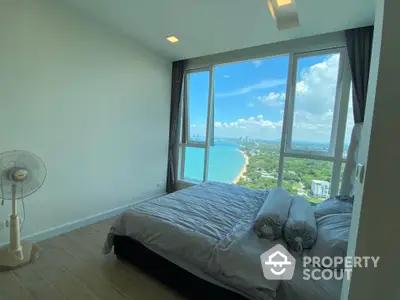 Stunning bedroom with panoramic ocean view in high-rise apartment