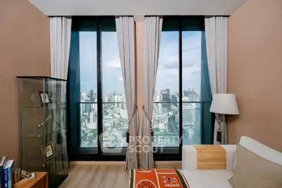 Luxurious living room with stunning city view from floor-to-ceiling windows.