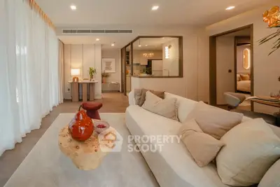 Luxurious modern living room with elegant decor and open layout, featuring cozy seating and stylish lighting.