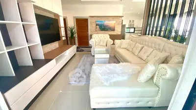 Luxurious living room with elegant white furniture and modern decor