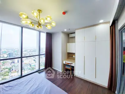 Modern bedroom with stunning city view, elegant lighting, and built-in storage in a high-rise apartment.