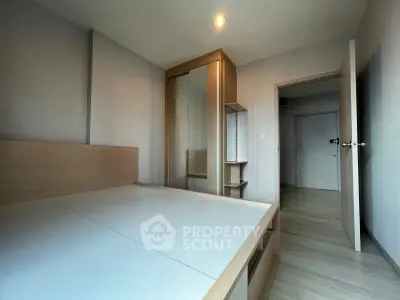 Modern minimalist bedroom with sleek furniture and neutral tones