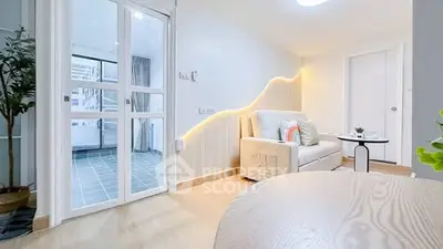 Modern living room with cozy sofa and stylish lighting in a bright apartment.