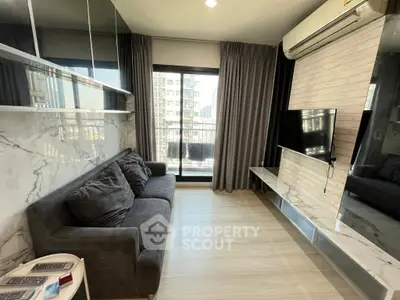 Modern living room with marble accents and city view balcony