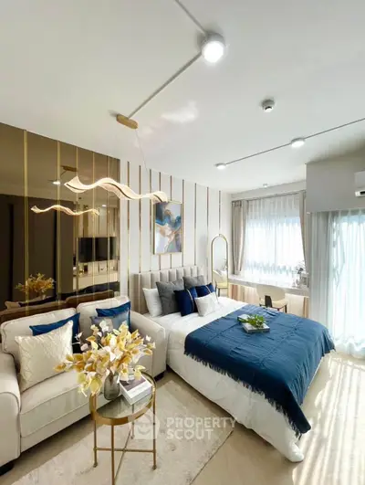Luxurious bedroom with elegant decor and natural light, featuring a cozy seating area and stylish lighting.