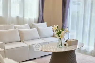 Elegant living room with white sofa and stylish coffee table