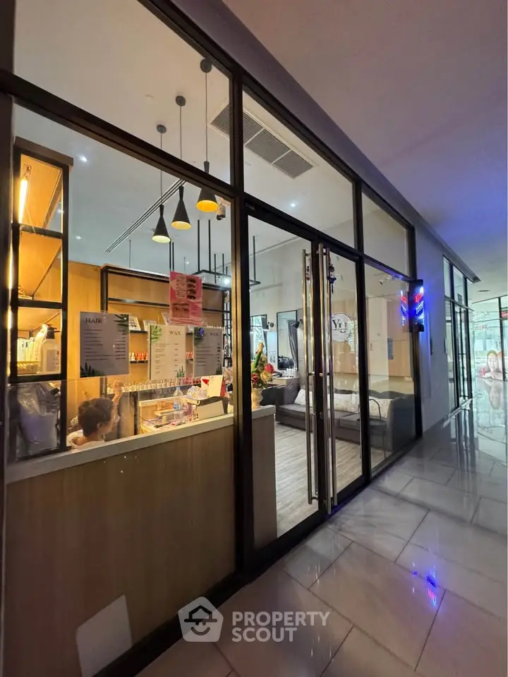 Modern commercial space with glass facade and stylish interior lighting