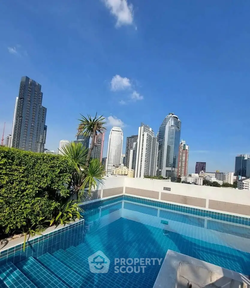 Stunning rooftop pool with panoramic city skyline view