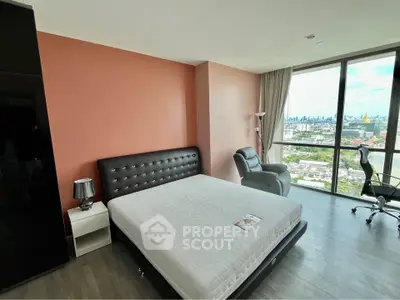 Spacious bedroom with stunning city view and modern furnishings in high-rise apartment.