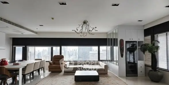 Spacious modern living room with panoramic city view and elegant decor.