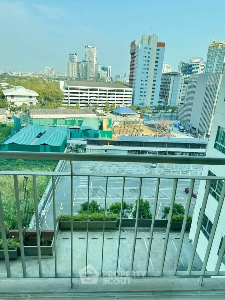 Stunning cityscape view from a high-rise balcony, perfect for urban living enthusiasts.