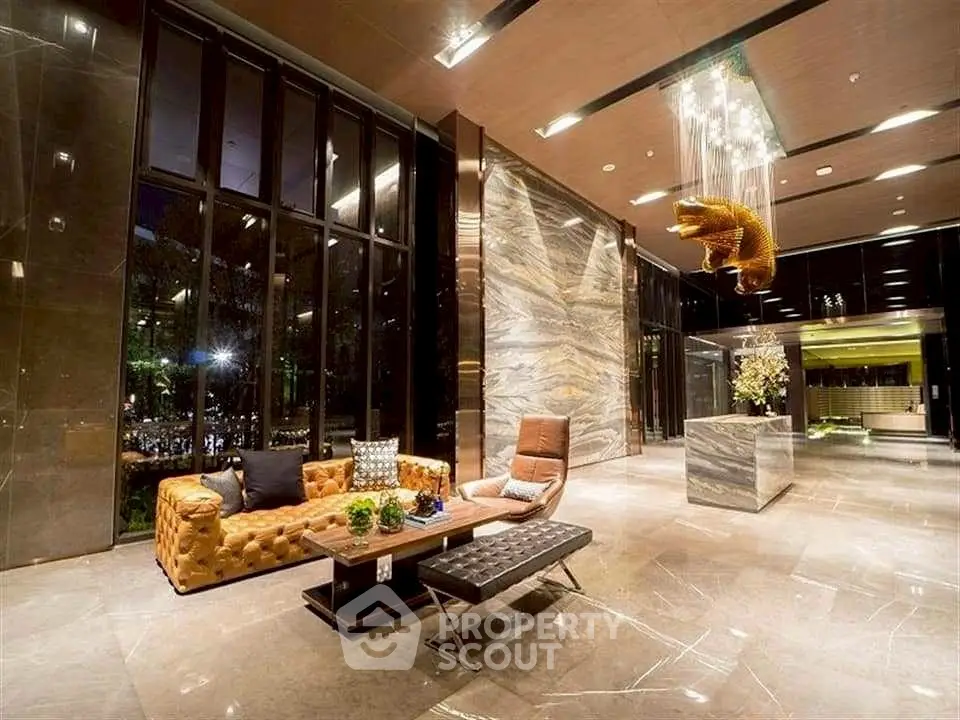 Luxurious modern lobby with elegant seating and stunning chandelier