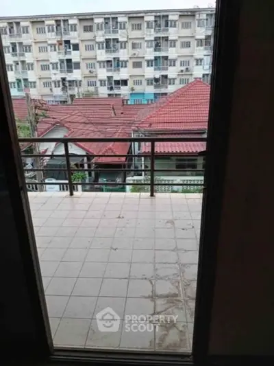 Spacious balcony with city view in residential area, perfect for relaxation and enjoying the outdoors.