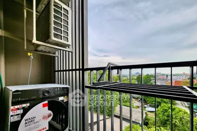 Modern balcony with washing machine and scenic city view