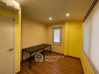 Bright study room with wooden flooring and minimalist design