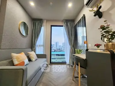 Modern living room with city view, stylish decor, and cozy seating in urban apartment.