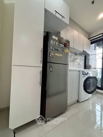 Modern kitchen with sleek appliances and ample storage space