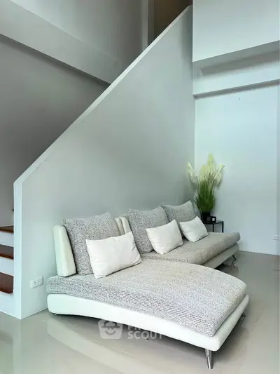 Modern living room with stylish sofa and minimalist decor