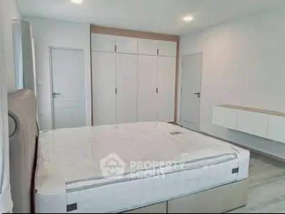 Modern bedroom with sleek built-in wardrobe and minimalist design