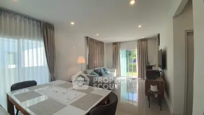 Spacious modern living room with elegant decor and abundant natural light