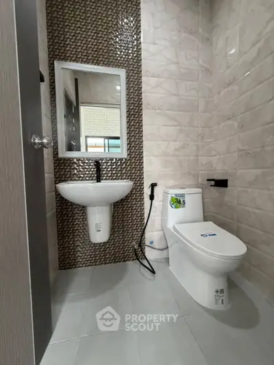 Modern bathroom with sleek fixtures and stylish tile design