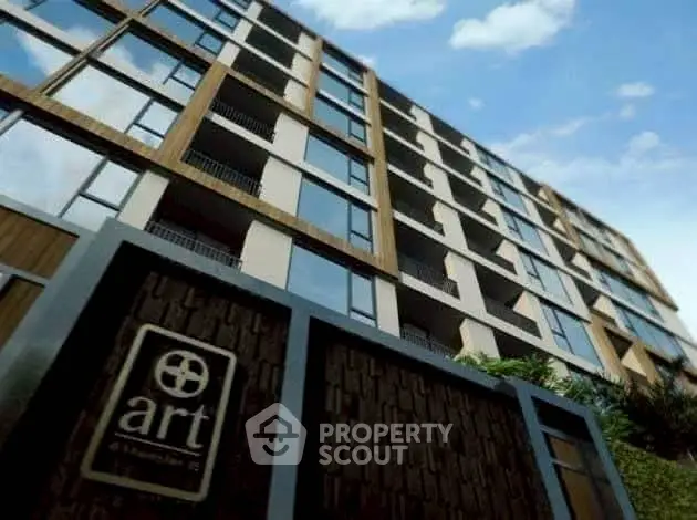 Modern apartment building with unique architectural design and large windows.