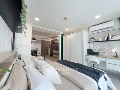 Modern bedroom with stylish decor and integrated study area