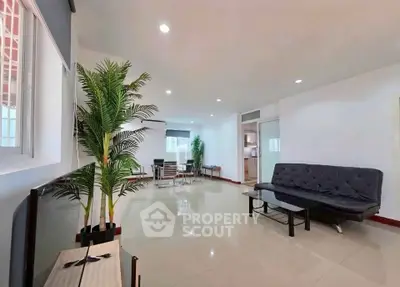 Spacious modern living room with sleek furniture and large windows