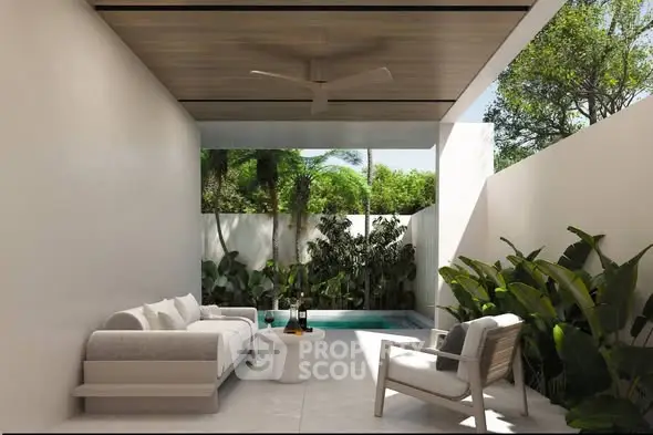 Luxurious outdoor patio with modern furniture and private pool surrounded by lush greenery.