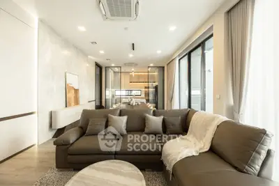 Luxurious modern living room with elegant leather sofa and open layout