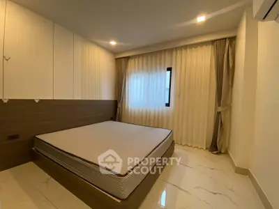 Modern bedroom with minimalist design and large window