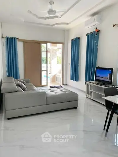 Modern living room with sleek furniture and natural light