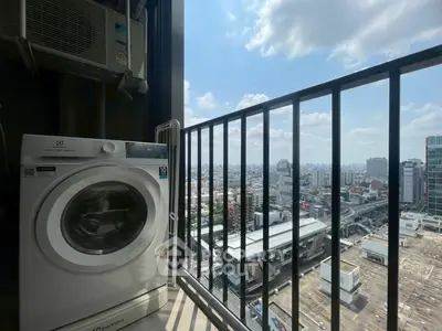 High-rise balcony with washing machine and stunning cityscape view