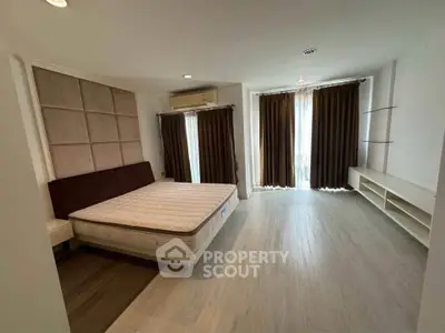 Spacious bedroom with modern design and natural light