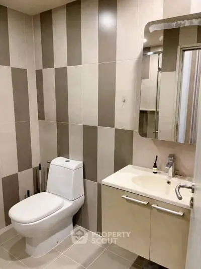 Modern bathroom with sleek design and stylish striped tiles