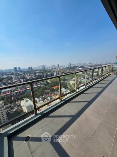 Stunning high-rise balcony with panoramic city views and ample space.