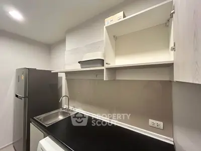 Modern kitchen with sleek cabinetry and stainless steel appliances