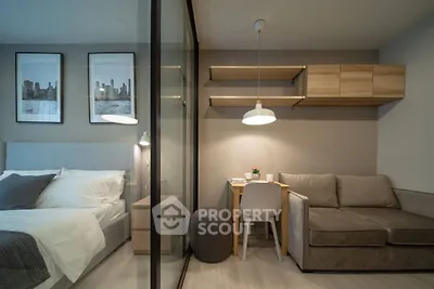 Modern studio apartment with cozy bedroom and stylish living area