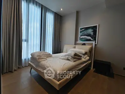 Modern bedroom with large windows and stylish decor