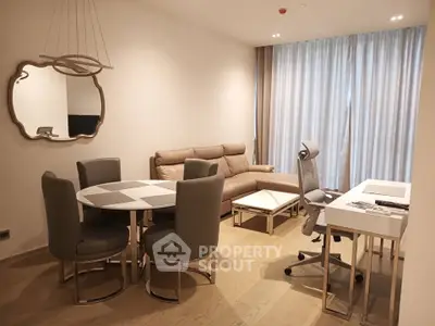 Modern living room with stylish furniture and elegant decor, featuring a cozy seating area and a sleek dining table.
